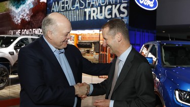 Ford President and CEO Jim Hackett, left, meets with Dr. Herbert Diess, CEO of Volkswagen, Monday, January 14, 2019, at the North American International Auto Show in Detroit.