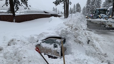 This Feb. 17, 2019 photo provided by City of South Lake Tahoe shows a car buried in snow in South Lake Tahoe, Calif.