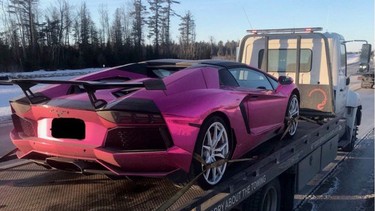 The OPP tow a purple Lamborghini in Ottawa in February 2019.