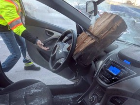 A piece of wood lodged in a driver's windshield near Toronto, following an accident January 31, 2019.