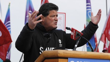 Jerry Dias, the national president for Unifor, the national union representing auto workers, addresses a rally within view of General Motors headquarters, Friday, Jan. 11, 2019, in Windsor, Ont.