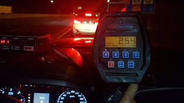 A radar gun with a recorded 254 km/h speed reading on it, shot March 2019 in Mississauga, near Toronto.