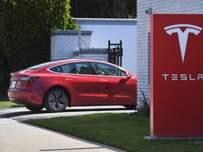 A Tesla car arrives at a service center in Los Angeles, California on March 4, 2019.