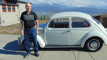 Walter Altenmueller with the 1966 Volkswagen he restored in honour of a U.S. war hero who was shot to death in a robbery attempt.