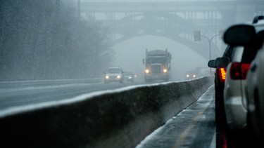 Traffic drives along the Don Valley Parkway on an unseasonably rainy and snowy spring day in Toronto, Ontario, April 11, 2013.