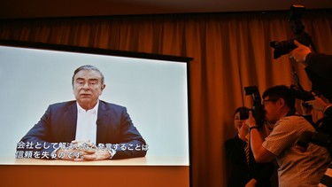 Journalists look on as lawyers for former Nissan chief Carlos Ghosn play a video message recorded by Ghosn before his most recent rearrest, during a press conference at the Foreign Correspondents' Club of Japan in Tokyo on April 9, 2019.