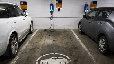 An EV electric vehicle charging parking spot in a parking lot at UBC, in Vancouver, British Columbia, February 20, 2019