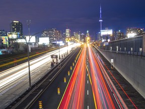 Traffic is blurred in a timed exposure on the Gardiner Expressway during the evening rush hour in Toronto, Ont. on Wednesday April 30, 2014.