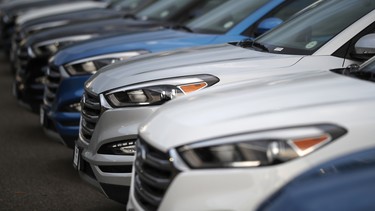 In this file photo, unsold Hyundai Tucson crossovers sit at a dealership in Littleton, Colo.