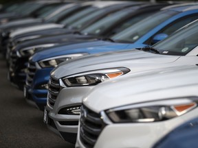 In this file photo, unsold Hyundai Tucson crossovers sit at a dealership in Littleton, Colo.
