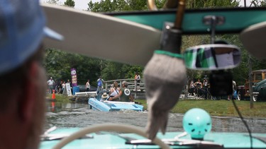 An Amphicar driving around the lake at the 2015 Fleetwood Country Cruize-In, hosted by Steve Plunkett in London, Ontario