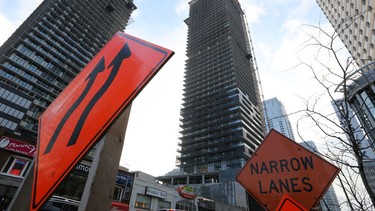 Signs warning motorists of a construction zone stand near RioCan's ePlace project, a commercial/residential development in Toronto, Ontario, Canada December 19, 2017.