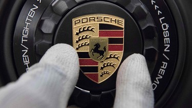 In this file photo taken on January 26, 2018 the logo of German luxury car producer Porsche is mounted on the wheel rim of a Porsche sportscar in the company's factory in Stuttgart, southwestern Germany.