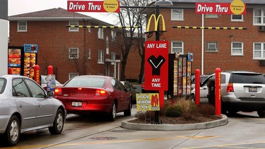 Vehicles in two separate drive-up lanes place orders at a McDonald's drive-thru location January 17, 2006 in Rosemont, Illinois.