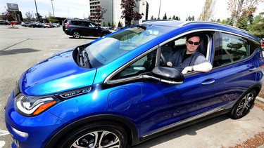 Travis McKeown with his new blue Chevy Bolt  in Richmond, BC., May 6, 2019.