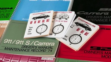 An arrangement of Porsche driver's manuals