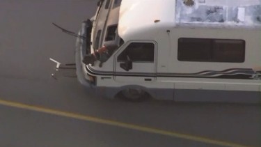 A dog leaning out the window of an RV during a wild Los Angeles police chase in May 2019