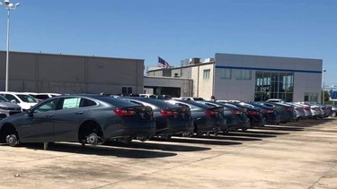 A row of vehicles with stolen wheels at Matt Bowers Chevrolet in Slidell, Louisiana
