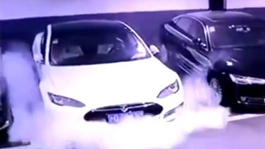 In April, a white Tesla Model S was caught on camera emitting smoke, before catching fire.
