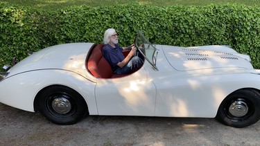 Alan Craighead, age 97, at the wheel of his 1950 Jaguar XK120 roadster, which he's owned for nearly four decades.