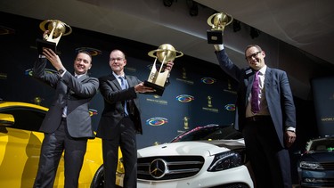 Christoph Horn (C), Director of Global Communications for Mercedes-Benz, accepts the award for 2015 Car of the Year on behalf of the Mercedes-Benz C-Class at the New York International Auto Show on April 2, 2015 in New York City.
