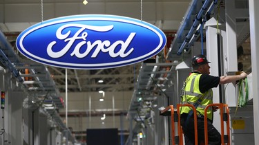 A contractor works on the yet-to-be-completed engine production line at a Ford factory on January 13, 2015 in Dagenham, England.