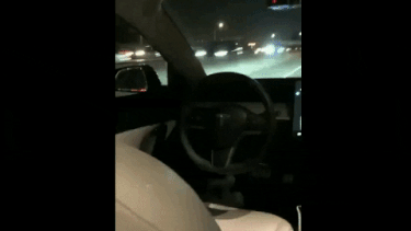 A video of a Tesla on Autopilot with no one in the driver's seat