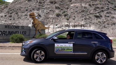Vancouver's Regina Chan poses for a photo op at Drumheller, Alberta during the first day of the 2019 EcoRun.