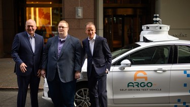 (From L-R) Jim Hackett, president and chief executive officer, Ford Motor Company, Bryan Salesky, chief executive officer and co-founder of Argo AI LLC and  Herbert Diess, chief executive officer, Volkswagen Group, pose for a picture ahead of a press conference July 12, 2019 in New York City.