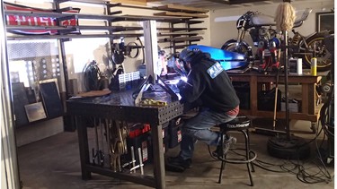 Joel Blaylock was 23 when he bought a house in Lethbridge and built this shop so he could work with metal, as he is doing here. His specialty is welding, but he’s also taken a metal forming course from Cristian Sosa of Sosa Metal Works in Las Vegas.