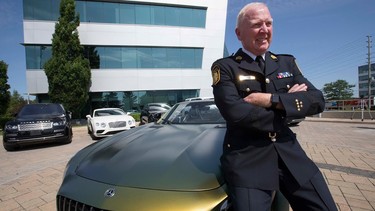 Chris McCord, acting Peel chief of police, with one of the vehicles confiscated in Project Baijin