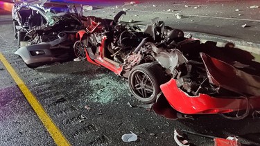 Damaged vehicles are shown in the aftermath of an accident on Sunday, Aug. 11, 2019 as two people died and three others were injured in a fiery crash on a busy highway in the Toronto area, police said Monday.