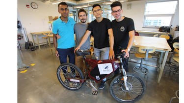 UBC ThunderBikes team members, left to right, Bhargav Thoom, Kevin Heieis, Huy Nguyen and Ramiro Bolanos with the team's electric MK3 mountain bike.