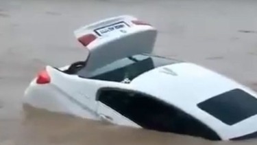 Man pushes BMW into a river in India