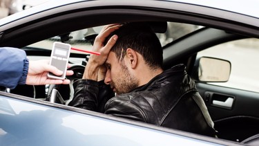 A driver failing a breathalyzer test