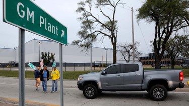 Members of the United Auto Workers (UAW) who are employed at the General Motors Co. Flint Assembly plant in Flint, Michigan, slow down salary employees entering the plant as they strike early on September 16, 2019.