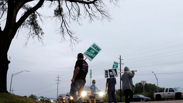 Members of the United Auto Workers (UAW) who are employed at the General Motors Flint Assembly plant in Flint, Michigan, slow down salary employees entering the plant as they strike early on September 16, 2019.