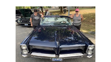 Sisters Louise Soga and Carolyn Obieglo with the 1964 Pontiac Parisienne convertible Carolyn has driven more than half-a-million miles.