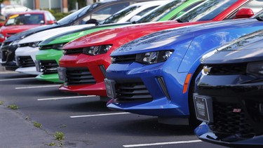 In this Wednesday, April 26, 2017, photo, Chevrolet Camaros are lined up in the lot of a Chevrolet dealership in Richmond, Va.