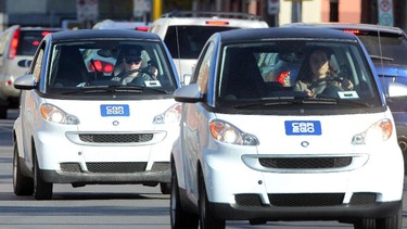 A couple of Car2Go vehicles are seen in the afternoon rush hour in downtown Calgary.