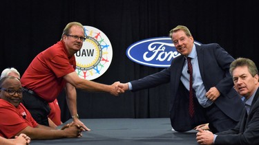 Gary Jones, president UAW International, (left) and Bill Ford, executive chairman, Ford Motor Company, shake hands today at Ford World Headquarters to begin negotiations for the 2019 contract.