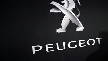 In this March 1, 2018 photo, the logo of Peugeot is displayed at PSA Peugeot Citroen headquarters during the presentation of the company's 2017 full year results, in Rueil-Malmaison, west of Paris, France.