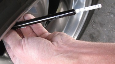 Checking tires with a stick gauge