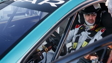 David Booth behind the wheel of Jaguar's I-Pace E-Trophy race car.