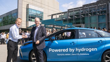 Toyota Canada's Stephen Beatty, right, with the company's FCEV, the Mirai.