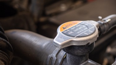 Never, ever open a coolant cap when your engine is hot, or even warm.