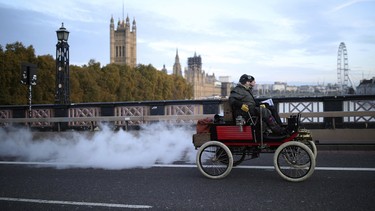 Participants drive their vehicle across Lambeth Bridge in London, during the London to Brighton Veteran Car Run on Sunday Nov. 3, 2019.