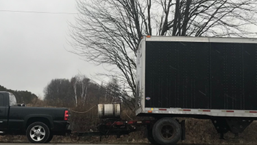 Driver ticketed for towing 53 foot trailer behind pickup truck