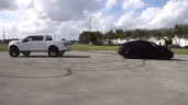 Watch: Tesla Model X and Ford Raptor engage in tug-of-war