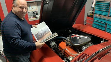 Danny Pantuso shows off some one of four binders filled with documentation of the history of his award-winning 1967 Corvette coupe.